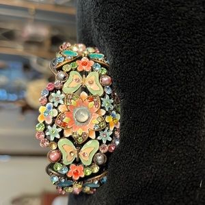 Copper colored metal with multi colored beads, stones and embellishments!